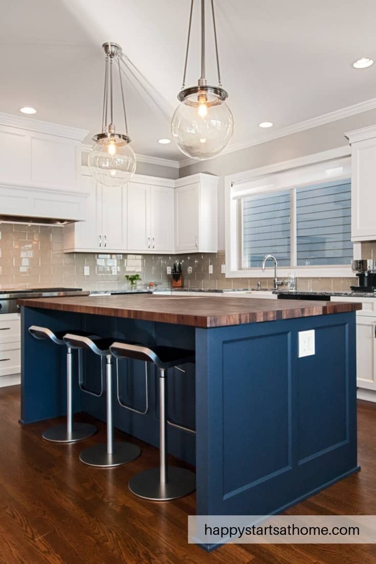 A Blue-Painted Island with a Butcher Block Countertop