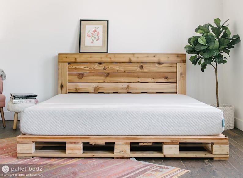 A rustic headboard made from pallet