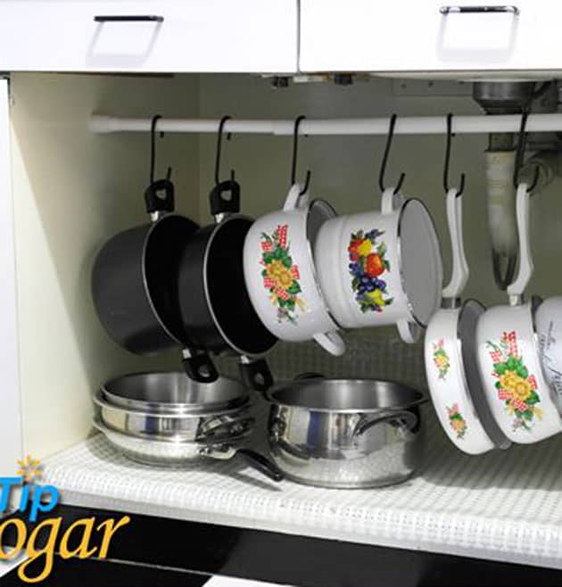 Use a Curtain Rod to Store Pots and Pans under kitchen sink
