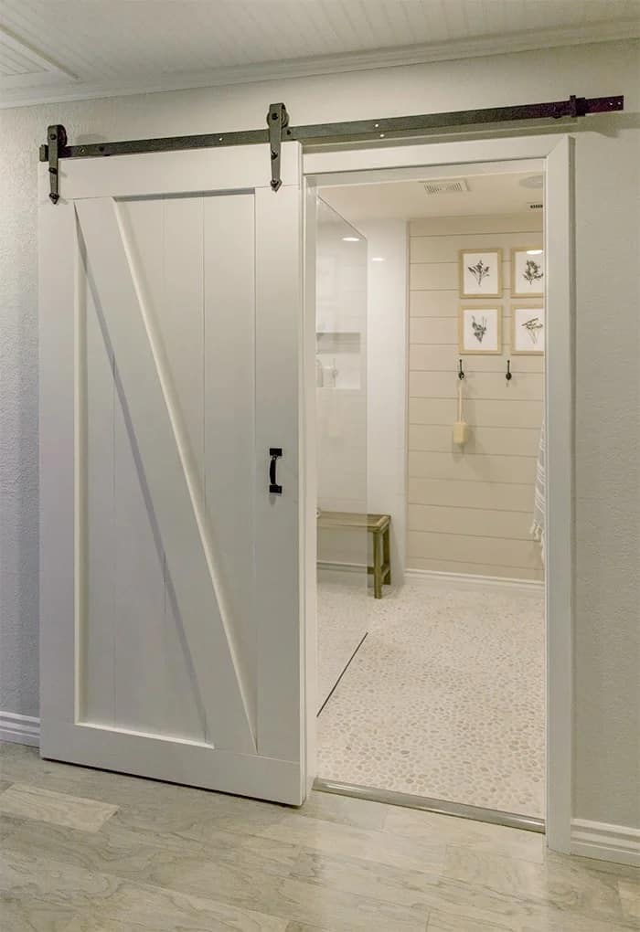 basement bathroom with barn door