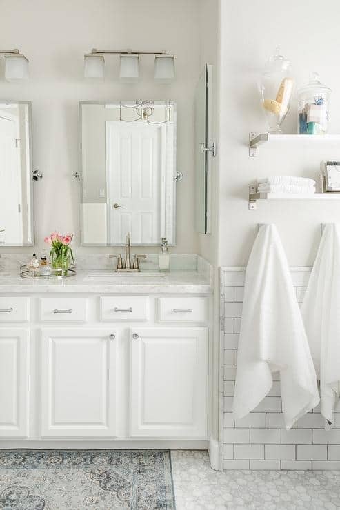 Bathroom With Towel Storage And Rug