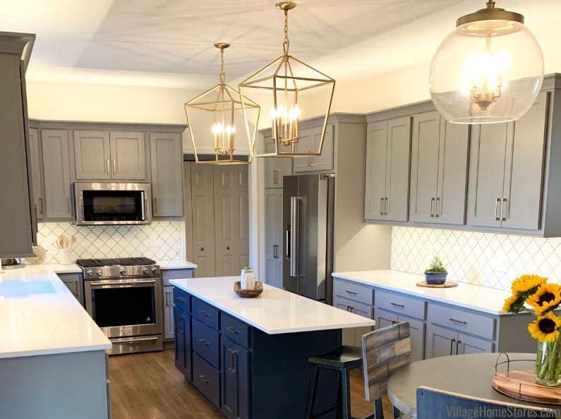 blue island with dark gray cabinet and white countertop