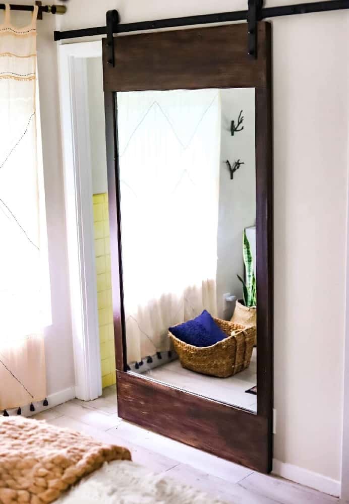 hang a mirror on the barn door